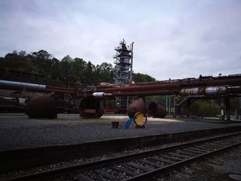 Train on railroad track against sky