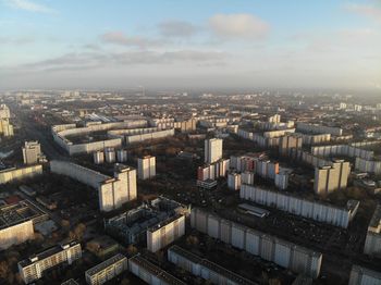 High angle drone view of buildings in berlin city against sunset sky