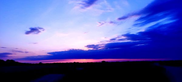 Scenic view of dramatic sky during sunset