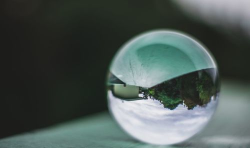 Close-up of water drop on crystal ball