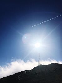 Low angle view of vapor trails in sky