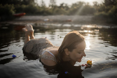 Girl in summer lake