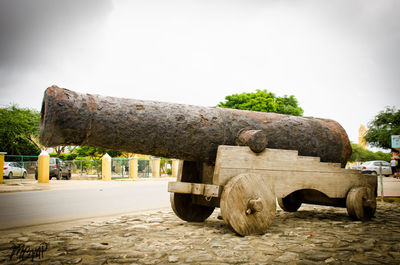 Built structure by trees against sky