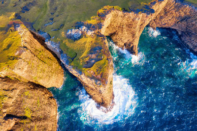 High angle view of rock formation in sea