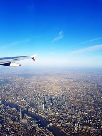 Airplane flying over city