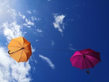 Low angle view of umbrella against sky