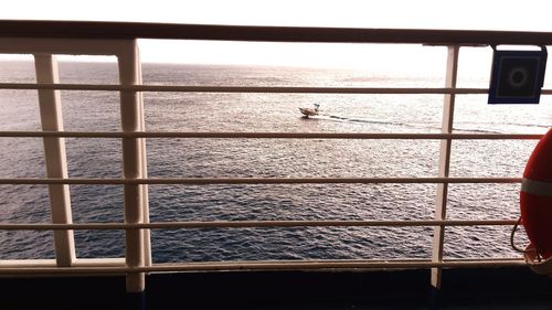 Scenic view of sea against sky seen through window