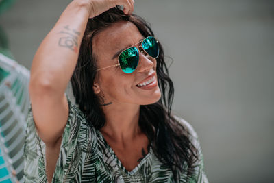 Portrait of young woman wearing sunglasses