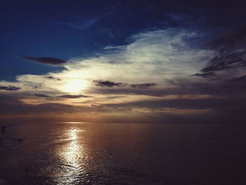 Scenic view of sea against sky at sunset