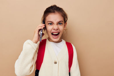 Girl screaming while talking on smart phone