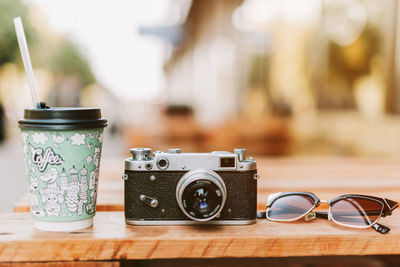 Close-up of camera on table