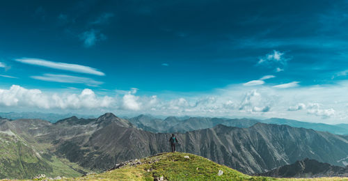 Scenic view of mountains against blue sky