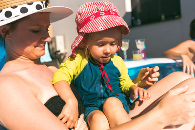 Summer sun with child concept. baby with mother in summer sun lifestyle