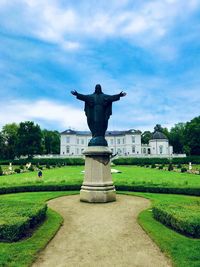 Statue in park against sky