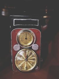 Close-up of clock on mirror