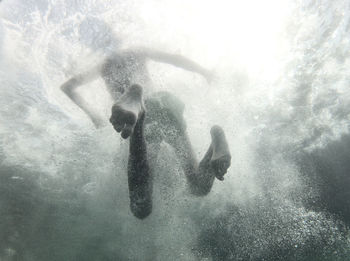 Boy swimming in sea