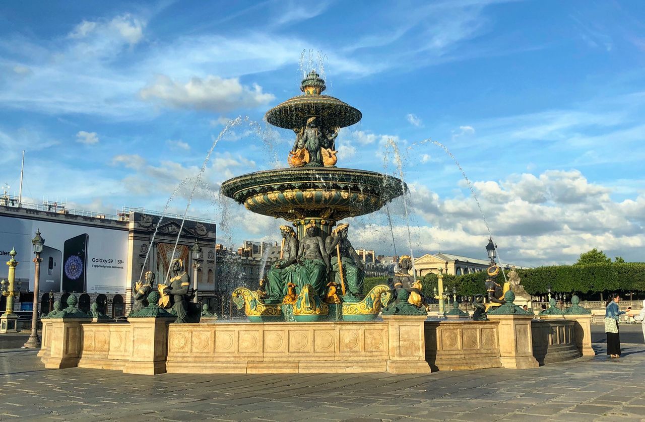 cloud - sky, sky, architecture, built structure, nature, building exterior, water, fountain, day, travel destinations, city, travel, tourism, incidental people, outdoors, human representation, sculpture, sunlight