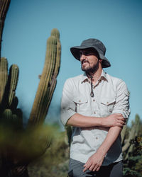 Portrait of man standing against sky