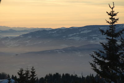 Scenic view of mountains against sky during sunset