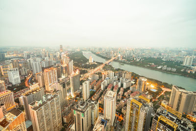 High angle view of city buildings against sky