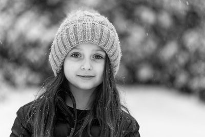 Portrait of cute smiling girl wearing warm clothing during winter