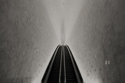 Low angle view of railroad tracks in tunnel