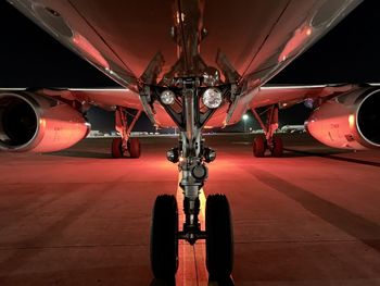 Airplane on airport runway at night