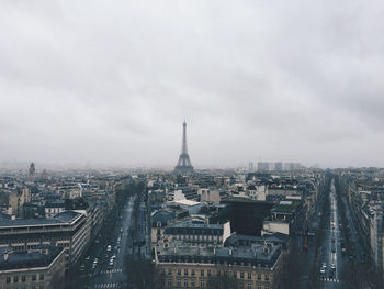 High angle view of cityscape with eiffel tower against sky