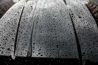 Full frame shot of raindrops on wet glass