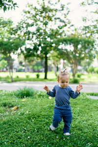 Full length of cute baby on tree