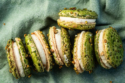 Green color pistachio macarons cream filled sandwich cookies