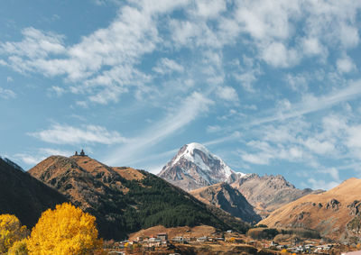 Scenic view of snowcapped mountains against sky