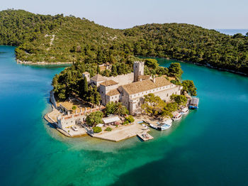 High angle view of swimming pool by sea against sky