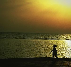 Scenic view of sea at sunset