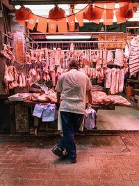 Rear view of people at market stall