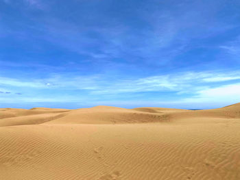 Scenic view of desert against sky