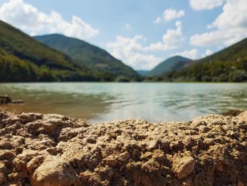 Scenic view of lake and mountains against sky