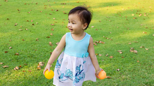 Cute girl standing on land