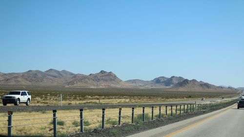 Country road leading towards mountains