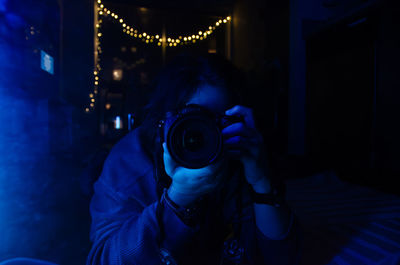 Woman photographing with camera