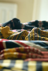 Wooden clothes on bed