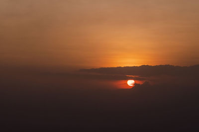 Scenic view of sea against romantic sky at sunset