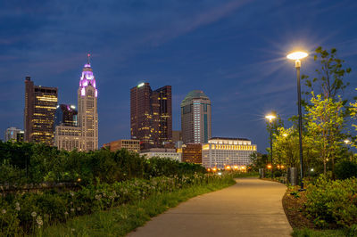 Illuminated city buildings at night