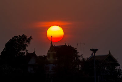 Low angle view of built structure at sunset