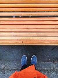 Low section of person standing on tiled floor