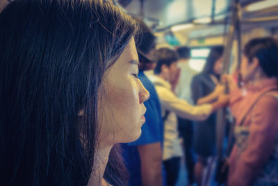 Close-up of woman traveling in train