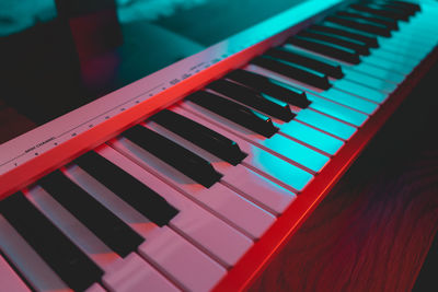 Piano keyboard in the neon lights