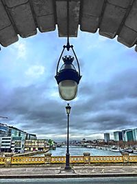 Cityscape against cloudy sky