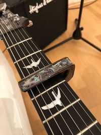 High angle view of guitar on table