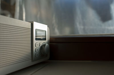 Alarm clock radio with the early hour on the windowsill display